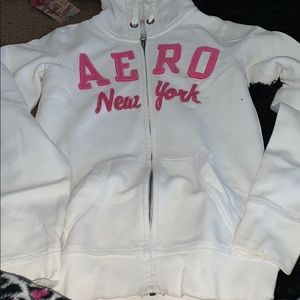 Pink and white zip up sweater